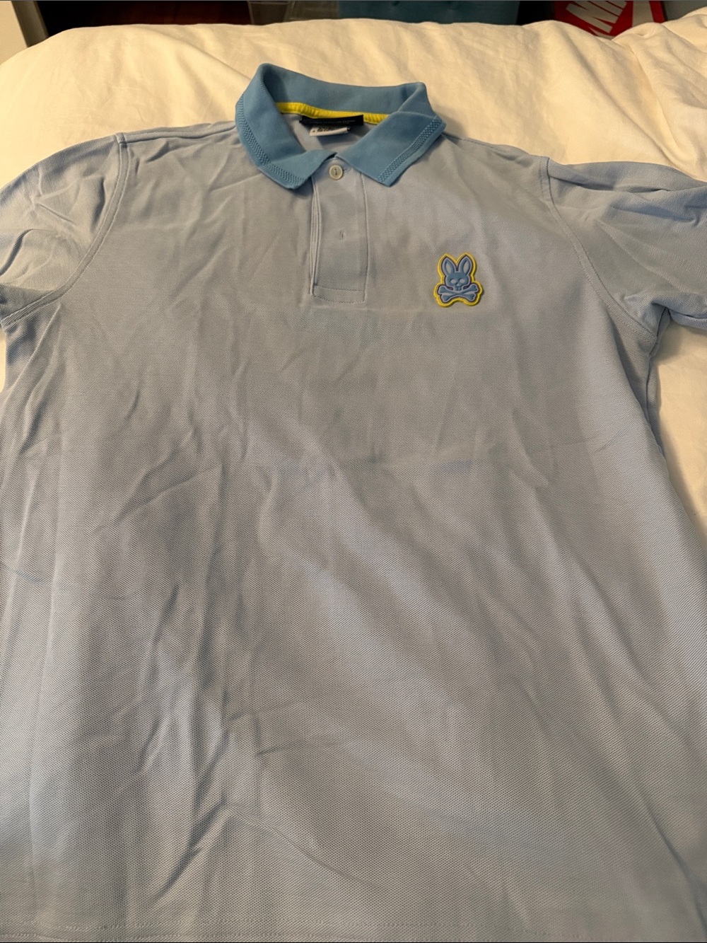 Psycho Bunny Light Blue Polo with Yellow-Trim Bunny Patch